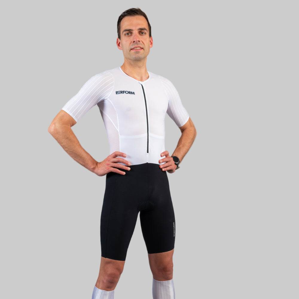 Man wearing white and black HyperTech FastSuit cycling suit with short sleeves on gray background