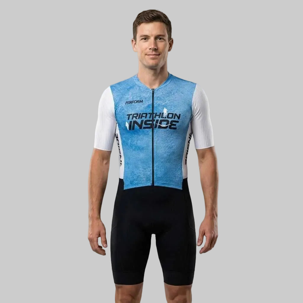 Man wearing blue and black TechBoost FastSuit triathlon suit with "Triathlon Inside" text