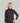 Vrouwelijke hardloper in zwarte TechBoost Running Jacket, wind- en waterafstotend, ademend en lichtgewicht, perfecte bewegingsvrijheid