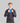 Man wearing black TechBoost Running Jacket for men, lightweight, wind and water-resistant with breathable fabric