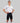 Man wearing white and black HyperTech FastSuit cycling suit with short sleeves on gray background
