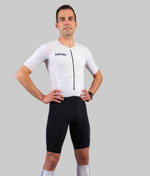 Man wearing white and black HyperTech FastSuit cycling suit with short sleeves on gray background