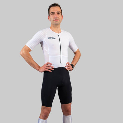 Man wearing white and black HyperTech FastSuit cycling suit with short sleeves on gray background