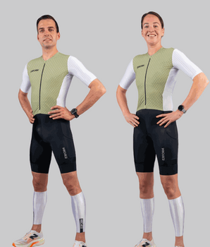 Men and women wearing sage and white Techboost FastSuit triathlon suits with aerodynamic design and black shorts