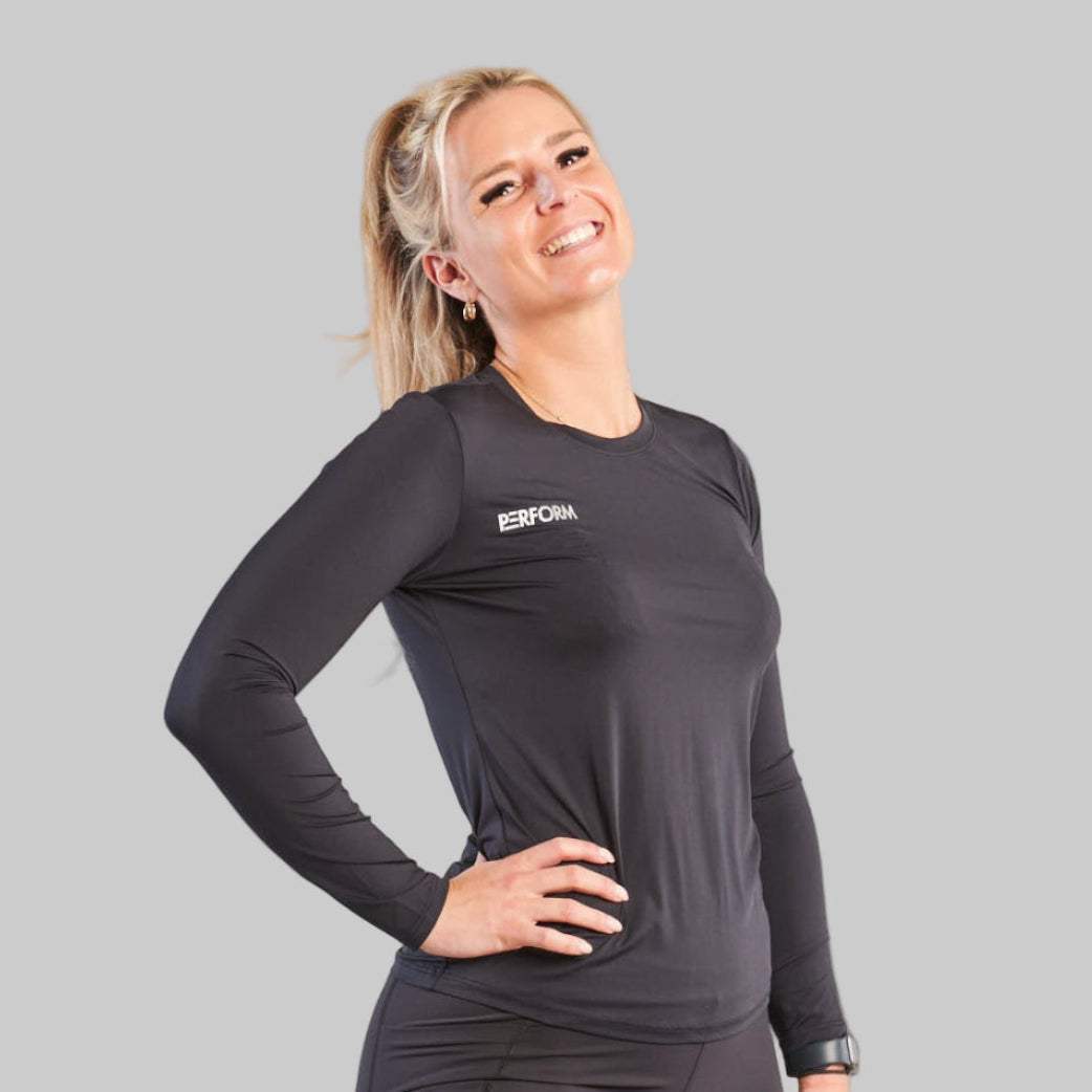 Woman wearing black Comfort T-Shirt LS for active movement and comfort